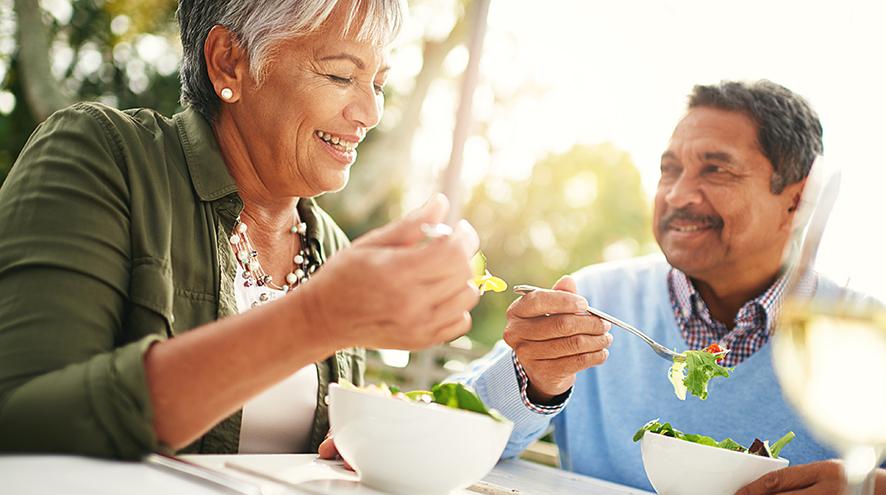 Senior couple eating a healthy meal.