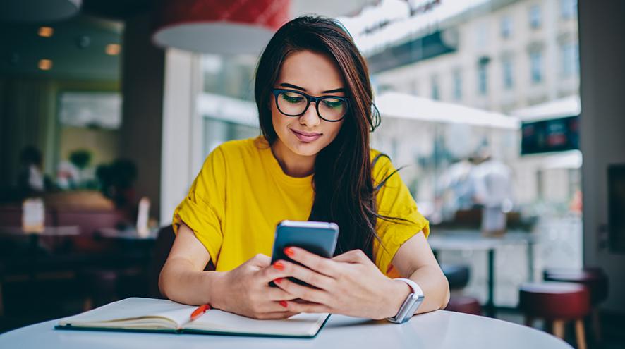 Young woman reading her phone.