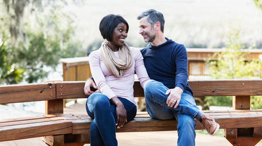 Midlife woman and man on bench