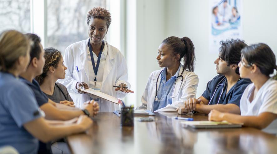 A group of doctors around a table