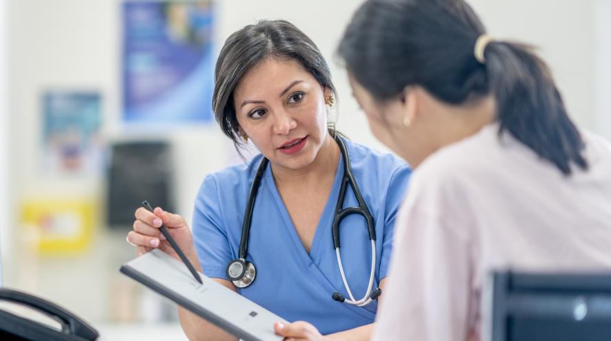 doctors sitting with a patient