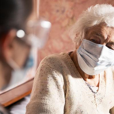 Senior woman wearing a mask.