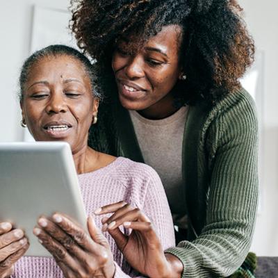 Mother and daughter using a tablet together.