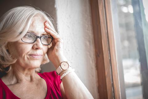 Senior woman thinking, looking worried.
