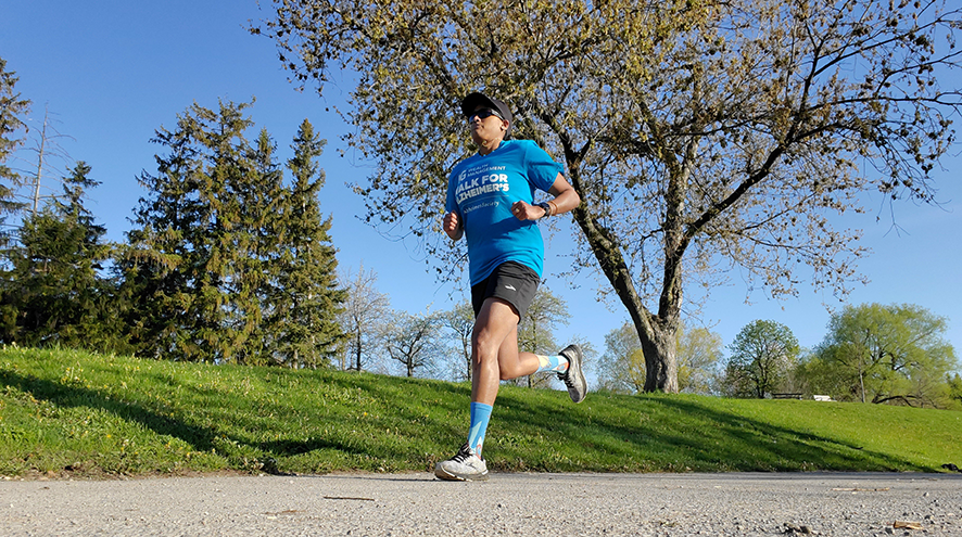 Denoja Uthayakumar running in the park.