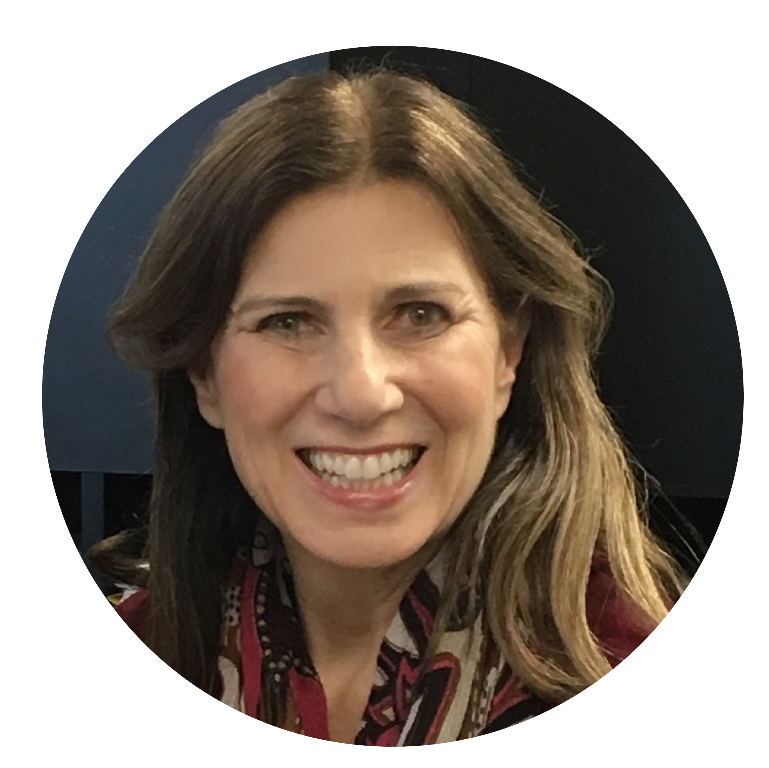 A midlife woman with long, light brown hair, smiling