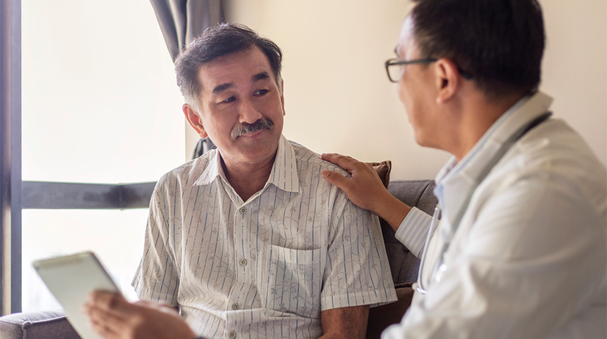 A doctor speaks with a patient