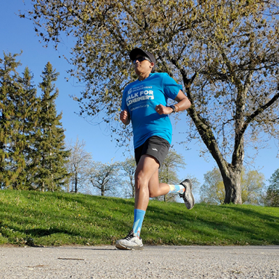 Denoja Uthayakumar running in the park.