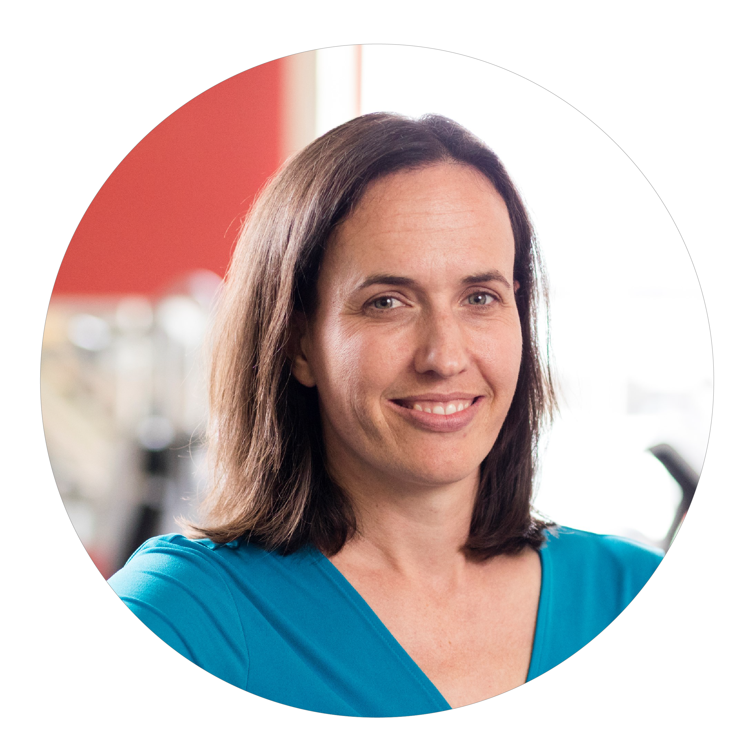 Woman with medium length brown hair in a bright blue shirt