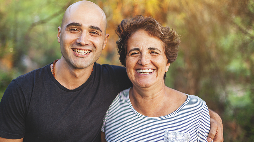 Mother and son smiling together.