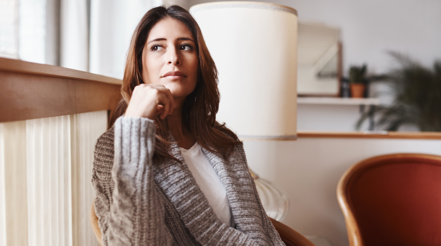 Young woman sitting down and thinking.