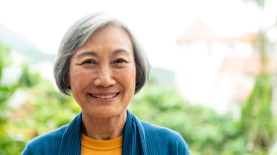 Older woman in yellow shirt