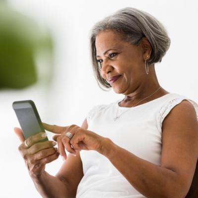 Senior woman using her phone.