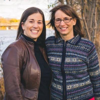 Cassandra and Karen Best, standing outside and smiling.