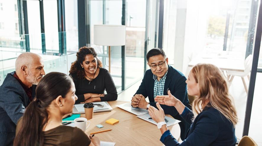 A group of people sitting at a table